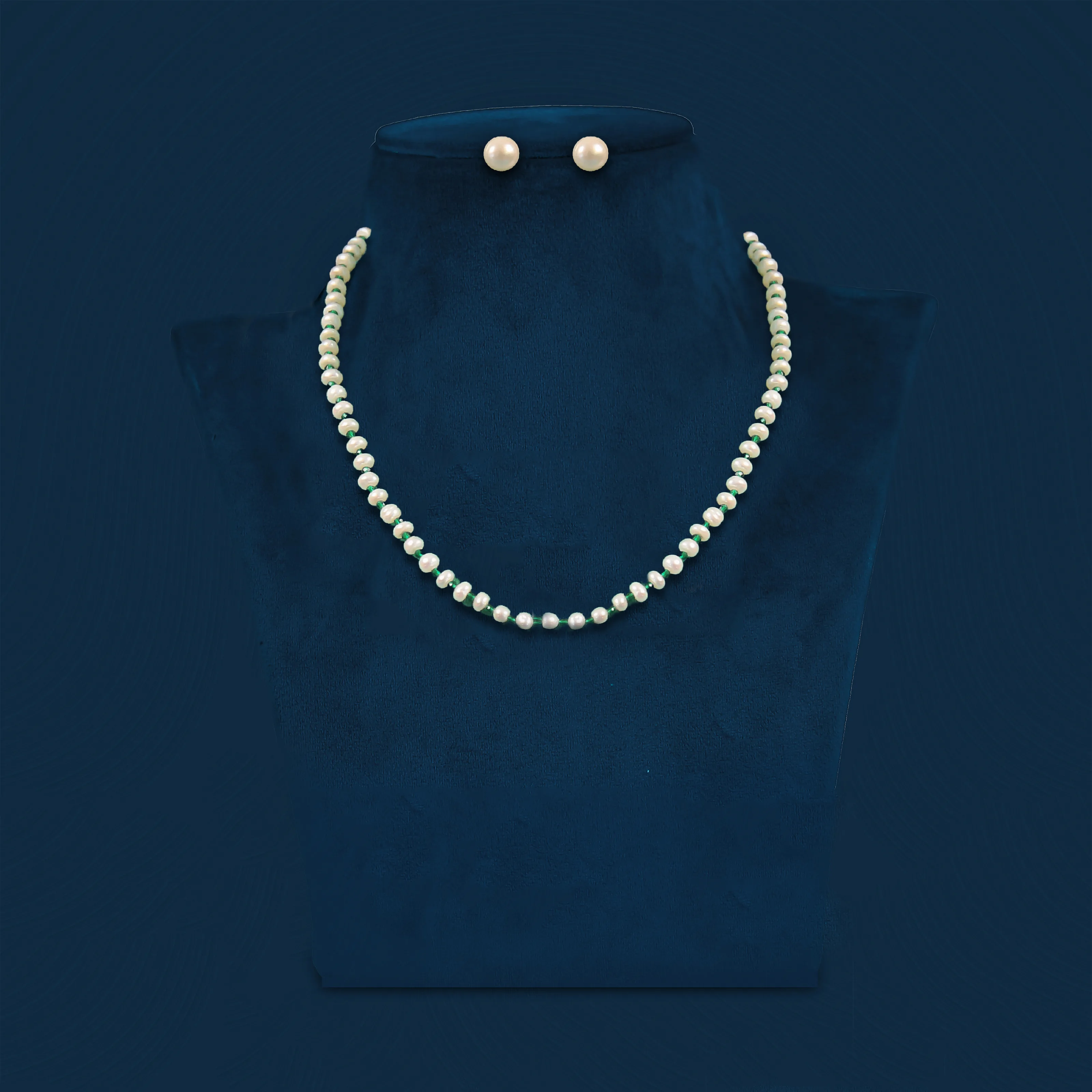 White pearl necklace with green bead spacers and pearl stud earrings