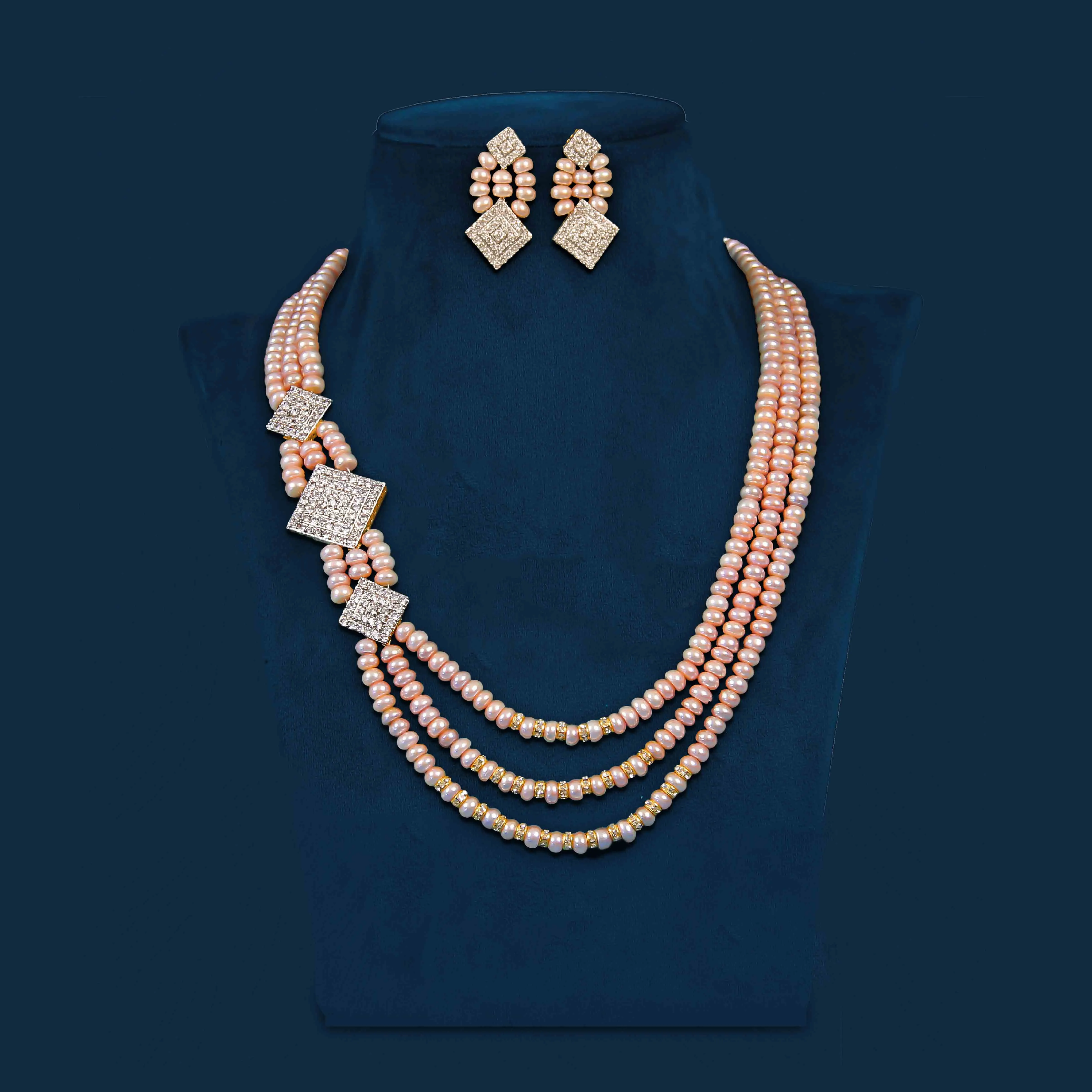 Three strand rose pearl necklace set with square cz accents (peach)