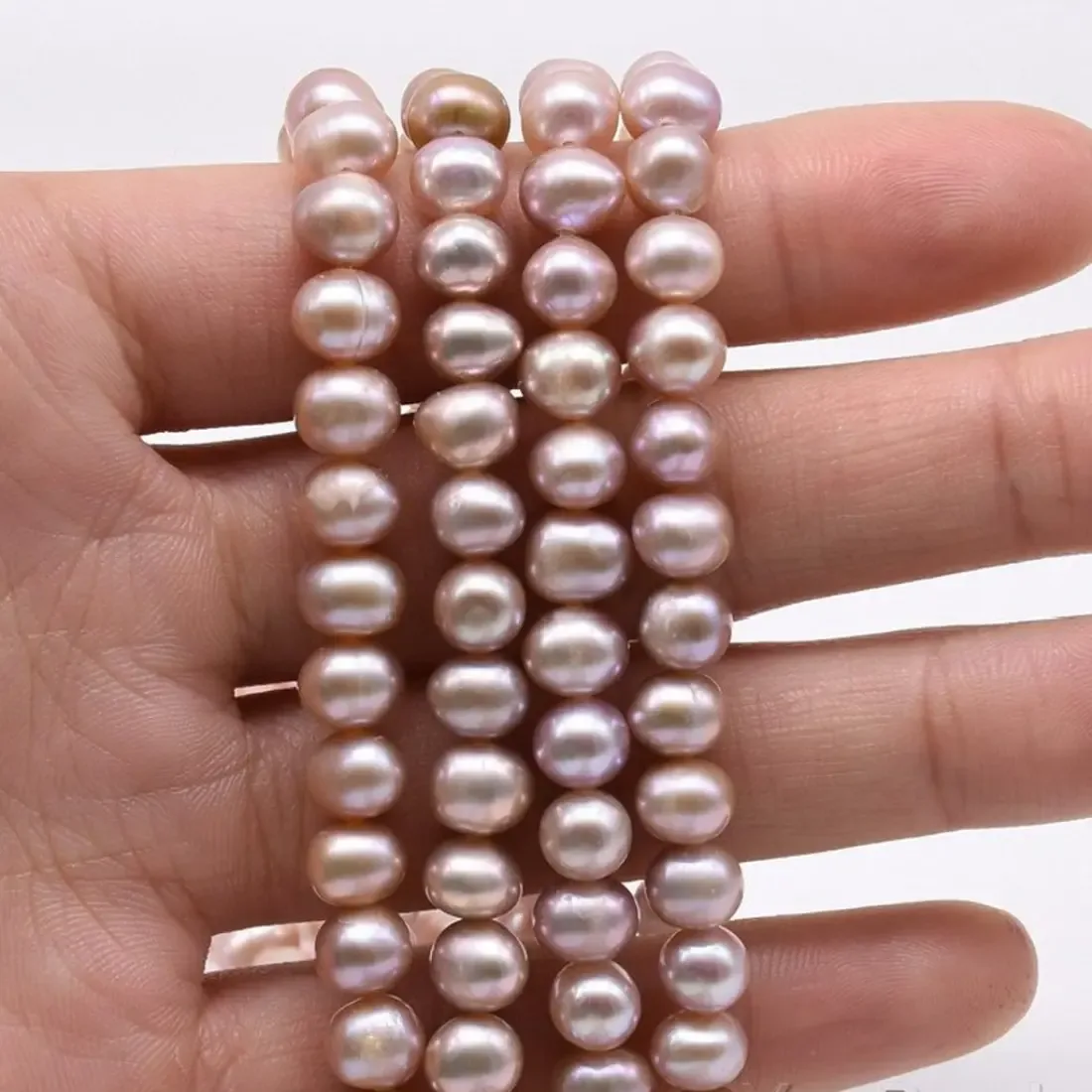 Pink/peach oval rice imitation pearl bead strand 6 x 5 mm, 16 inch