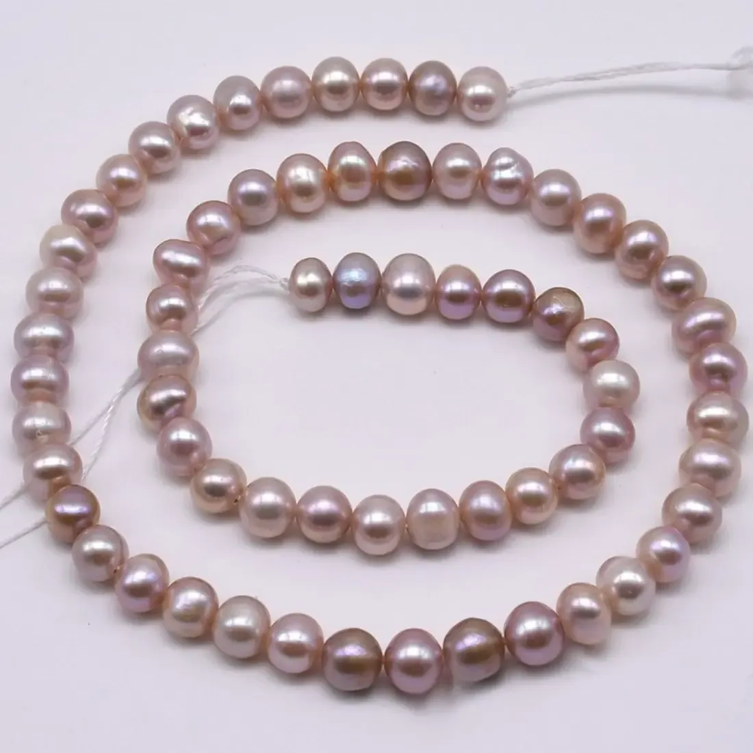 Pink/peach oval rice imitation pearl bead strand 6 x 5 mm, 16 inch