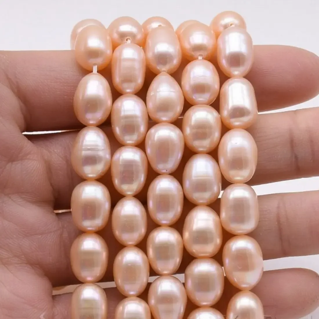 Peach pink oval rice imitation pearl bead strand 8 x 6 mm, 16 inch